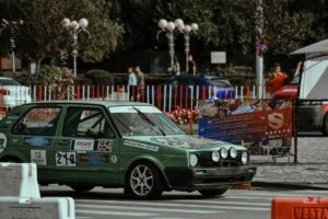 A car with various branding including magnetic car stickers