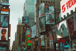 Time square has many different forms of large print advertising including billboards