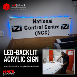 LED-backlit acrylic signage manufactured and supplied by Redblock Branding Solutions for a professional business interior.