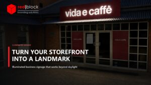 Illuminated Vida e Caffè shopfront signage in Pretoria with coordinated branded window graphics.
