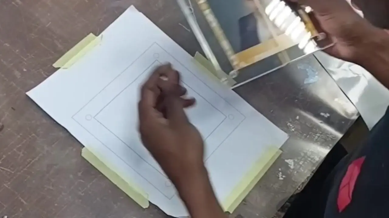 Close-up of a clear Perspex photo block during factory assembly at Redblock