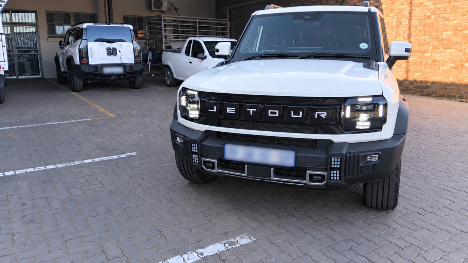 White Jetour T2 before full vehicle wrap application at Redblock Branding Solutions in Pretoria
