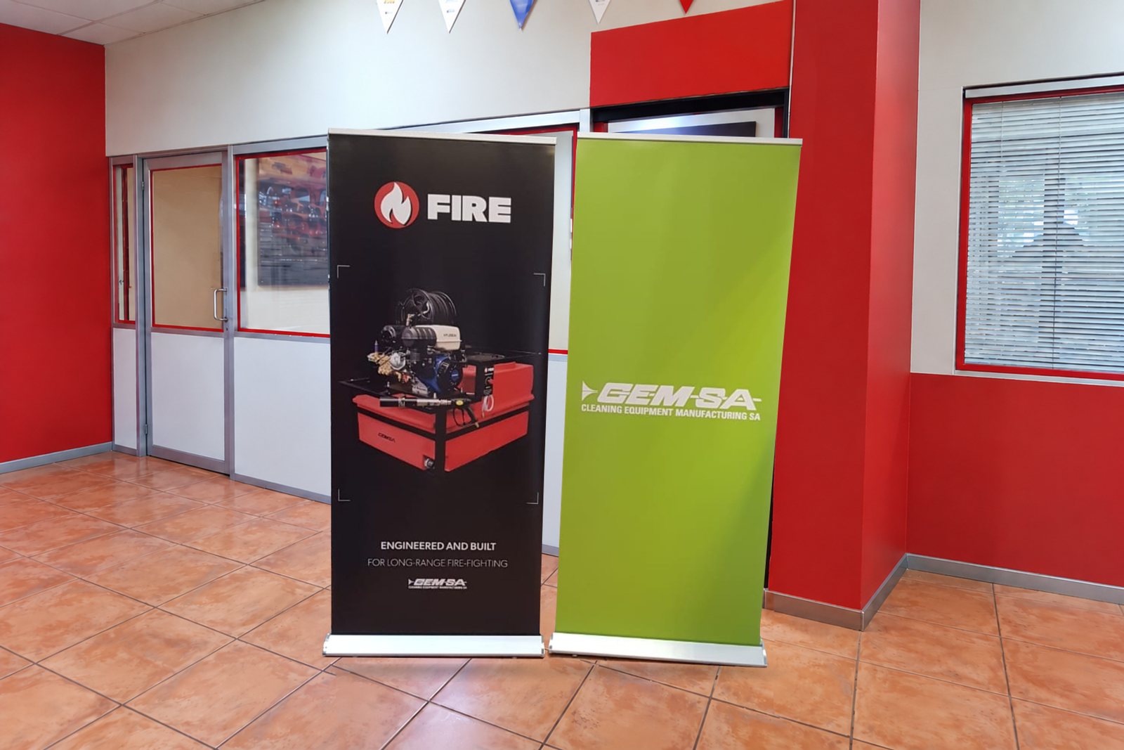 Two completed 850 mm x 2,000 mm executive roll-up banners produced for CEM-SA by Redblock Branding Solutions